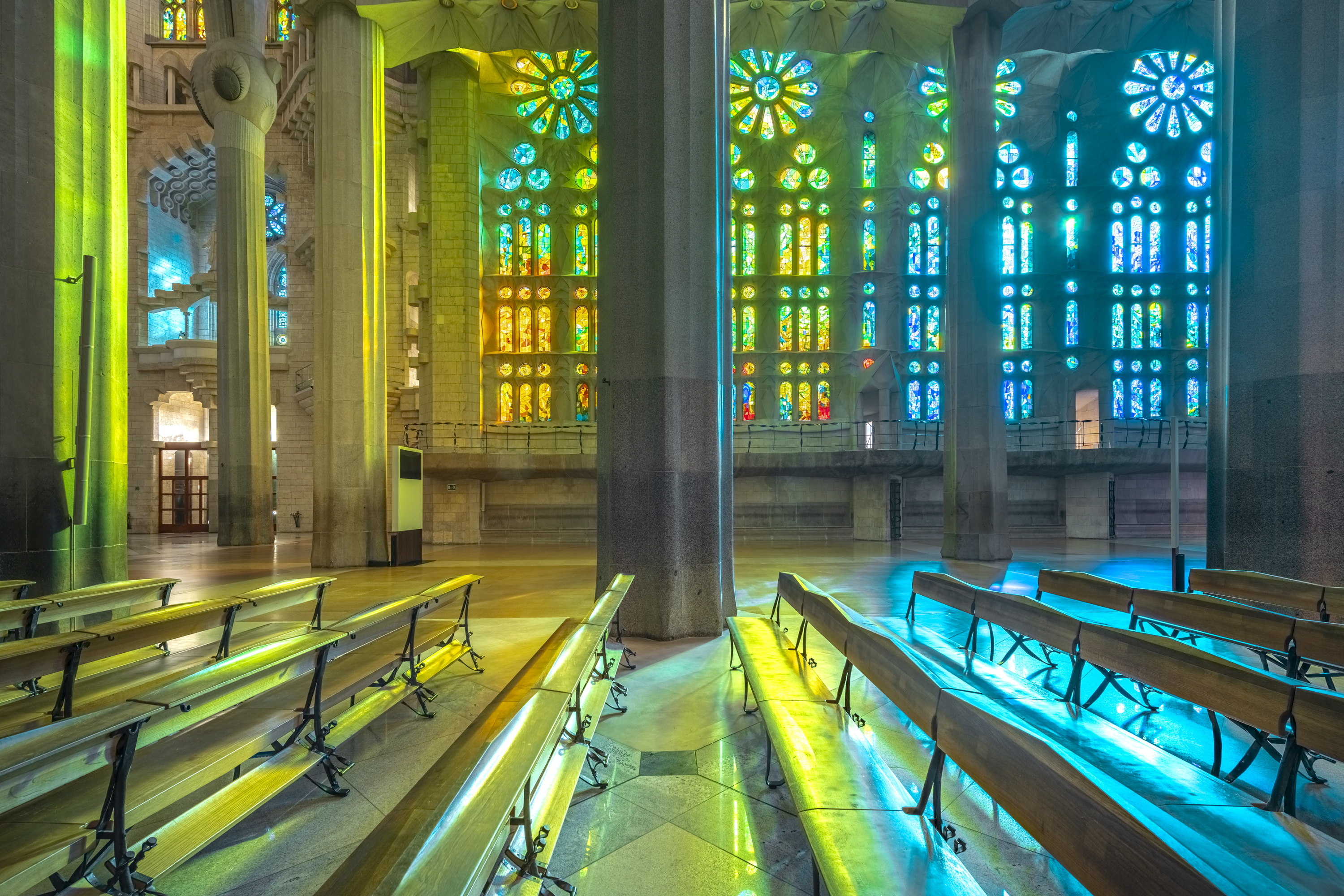 The windows on the Nativity façade have bluer tones, corresponding to the morning light